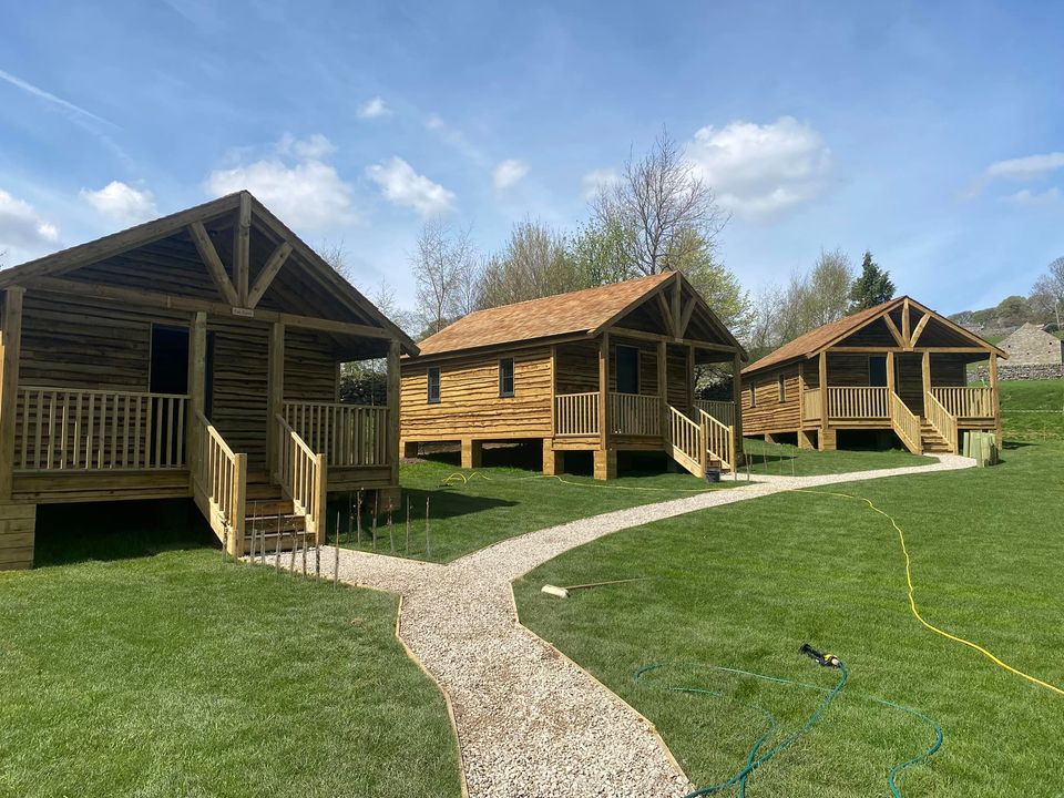 How Stean - outside view of rustic wooden lodges